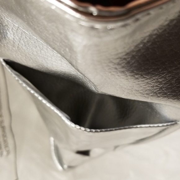 14 H x 18 L x 3 W
CLINIQUE Faux Leather Silver Sho - Picture 6 of 8